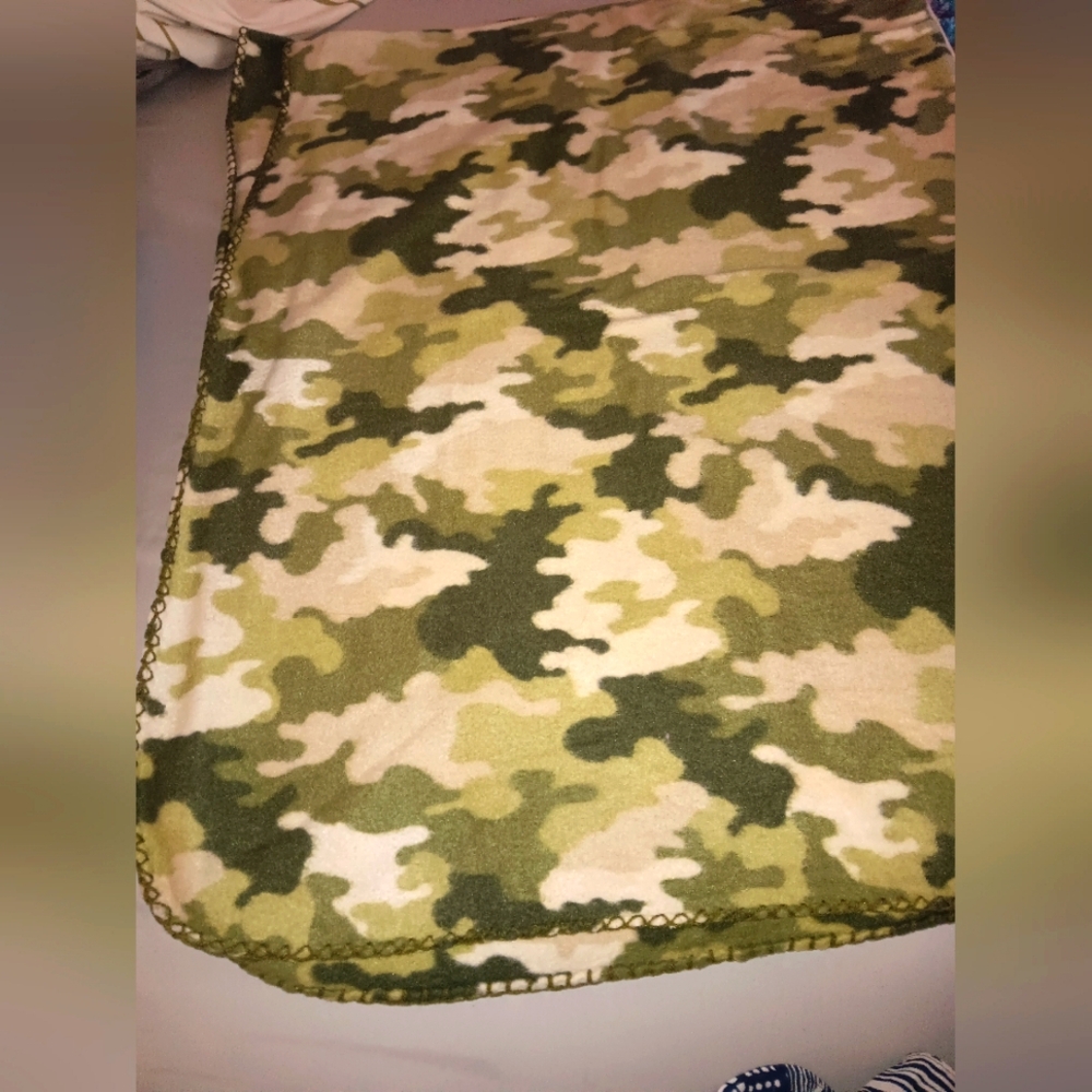 Lightweight camouflage throw blanket.  48 by 56